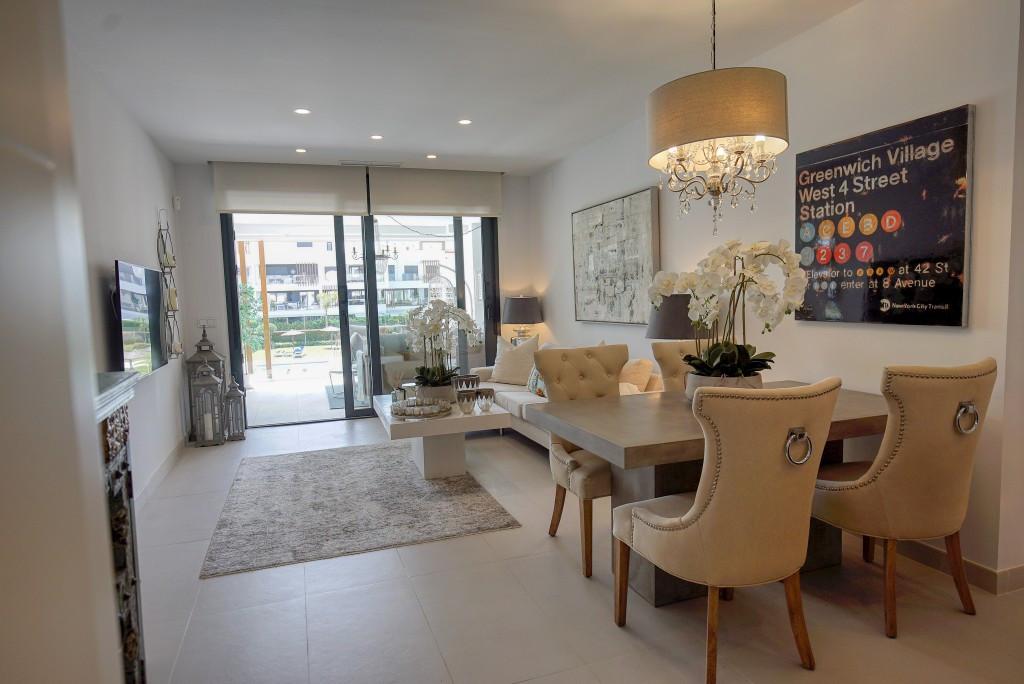 Stunning apartment in prime location with attention to detail in design, open plan living area, large terrace with views, two spacious bedrooms, underfloor heating, storage, underground parking. Close to beach, shops, and public transport.