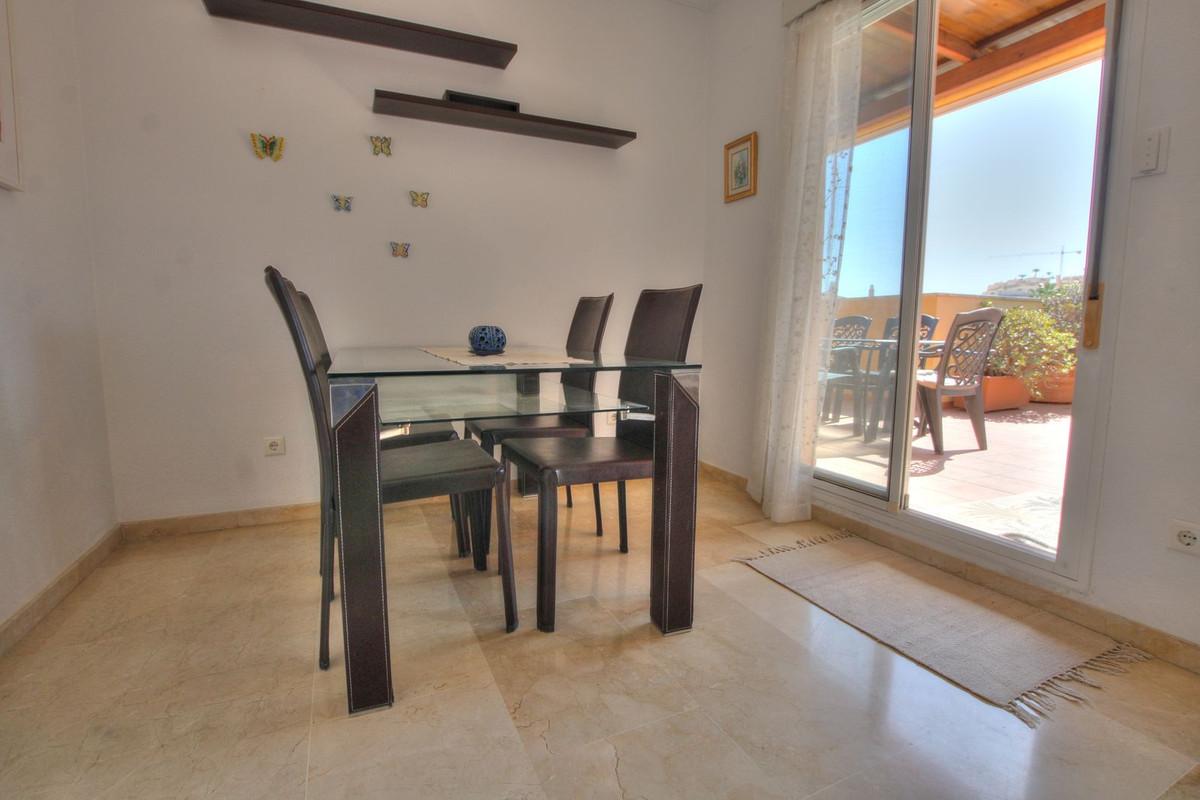 Penthouse with easy walk to La Cala de Mijas, featuring communal pool, paddle court, large terrace with sun all day, enclosed extra room, bright lounge, separate kitchen, en-suite bathroom, underground parking.