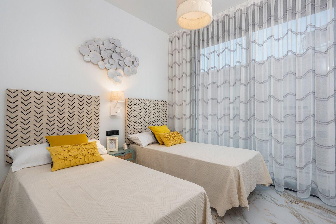 Modern coastal city building less than 500 meters from the beach in Guardamar del Segura. Features 2-3 bedroom homes with terraces, private solarium, storage room, Jacuzzi, underground parking, and commercial space.